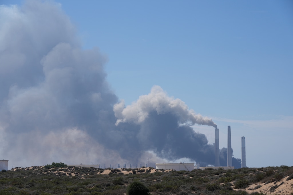 (Ohad Zwigenberg | The Associated Press) Smoke rises from an area near a power plant outside Ashkelon, Israel, on Saturday, Oct. 7, 2023. Palestinian militants in the Gaza Strip infiltrated Saturday into southern Israel and fired thousands of rockets into the country while Israel began striking targets in Gaza in response.