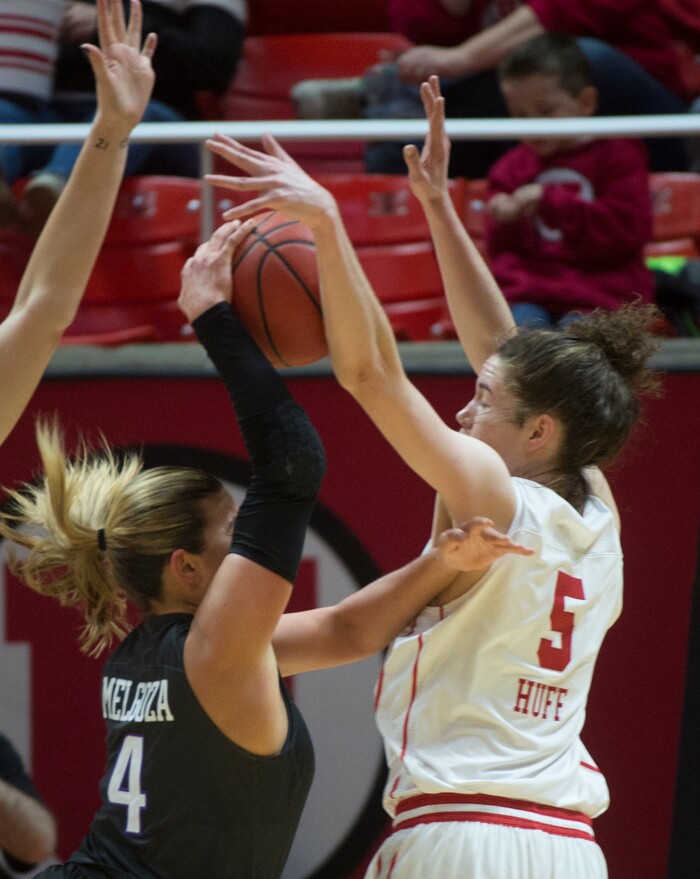 (Rick Egan  |  The Salt Lake Tribune)       Utah Utes center Megan Huff (5) blocks a shot by Washington Huskies guard Amber Melgoza (4), in PAC-12 women's basketball action at the Jon M. Huntsman Center, Sunday, Feb. 18, 2018.