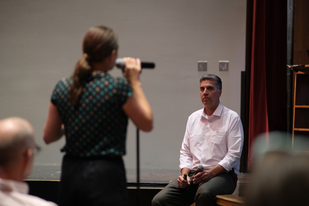 (Michael Lee | The Salt Lake Tribune) Salt Lake City School District director of Boundaries and Planning Brian Conley listens to a parent during a public information meeting regarding potential school closures on Sept. 12, 2023.