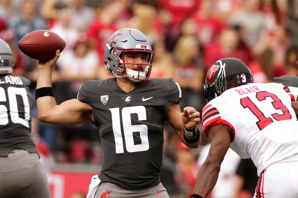 Washington State quarterback Gardner Minshew II (16) throws a pass while under pressure from Utah defensive back Marquise Blair (13) during the first half of an NCAA college football game in Pullman, Wash., Saturday, Sept. 29, 2018. (AP Photo/Young Kwak)