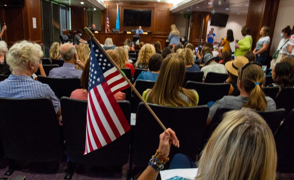 (Rick Egan  |  The Salt Lake Tribune)    Anti=-mask protesters speak do the remaining commissioners, Bill Lee and Nathan Ivie, after commissioner Tanner Ainge left the room, after the meeting was adjourned by a 2-1 vote because the room was too crowded and he felt that the crowd was breaking the health code, before the Utah County Commission meeting got started,  in Provo, on Wednesday, July 15, 2020.
