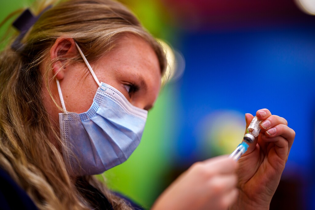 (Trent Nelson  |  The Salt Lake Tribune) Bailey Weems prepares doses of the Johnson & Johnson vaccine during a free COVID-19 clinic at Red Iguana 2 in Salt Lake City on Friday, Aug. 13, 2021.