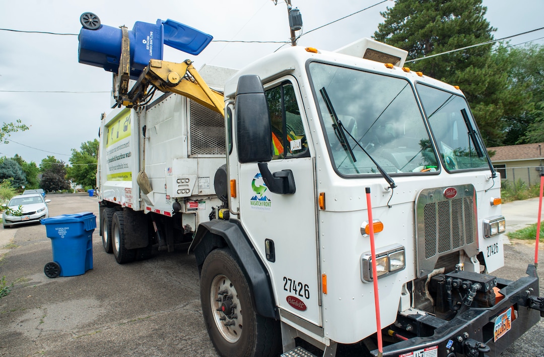(Rick Egan  |  The Salt Lake Tribune) A recycle truck collects recycled material in Sugarhouse for the Wasatch Front Waste and Recycling District on Friday, July 26, 2019.
