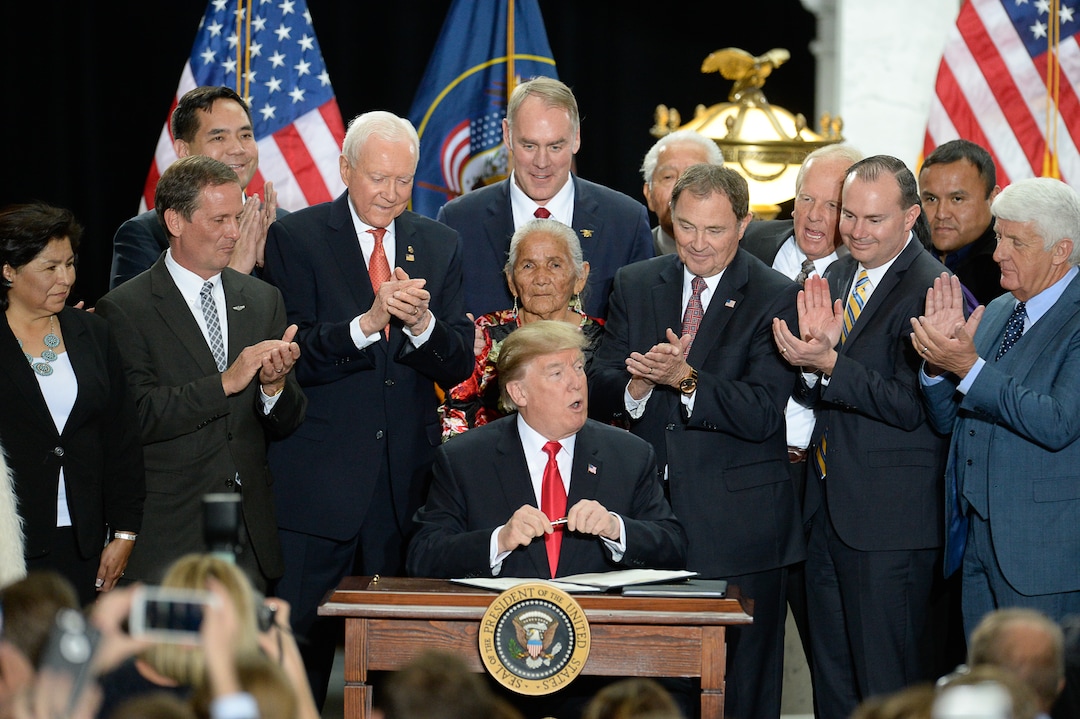 (Francisco Kjolseth  |  The Salt Lake Tribune)  U.S. President Donald Trump is surrounded by Utah representatives at the Utah Capitol on Monday, Dec. 4, 2017, as he signs a presidential proclamation to shrink Bears Ears and Grand Staircase-Escalante national monuments.