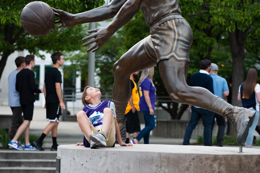 (Briana Scroggins | Special to The Tribune) Cooper Tweet, 9, of Riverton, looks up before he has his photograph taken outside of Vivint Smart Home Arena before the Jazz play the Memphis Grizzlies in Salt Lake City on Wednesday, May 26, 2021. It was Cooper’s birthday and first Jazz game of the season.