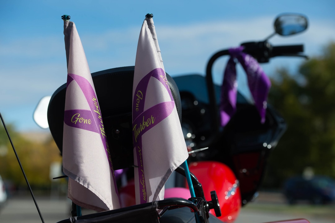 (Francisco Kjolseth  |  The Salt Lake Tribune) Bikers Against Domestic Violence, ride in support of friends who have died from domestic violence, represented on flags attached to their motorcycles as they make a stop at Liberty Park for the YWCA Utah on Saturday, Oct. 17, 2020, to recognize the thousands of individuals in Utah who are impacted by domestic violence each year for the Stop the Violence Utah campaign.