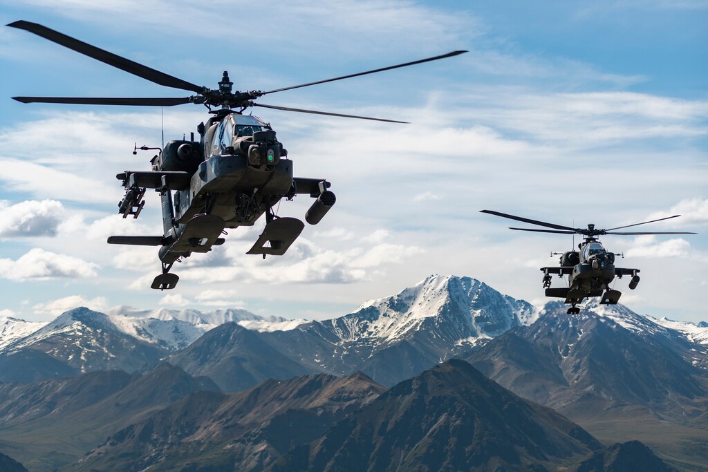 (Cameron Roxberry | U.S. Army via AP) In this photo released by the U.S. Army, AH-64D Apache Longbow attack helicopters from the 1st Attack Battalion, 25th Aviation Regiment, fly over a mountain range near Fort Wainwright, Alaska, on June 3, 2019. The U.S. Army says two Army helicopters similar to the ones in this picture crashed Thursday, April 27, 2023, near Healy, Alaska, killing three soldiers and injuring a fourth. The helicopters were returning from a training flight to Fort Wainwright, based near Fairbanks.