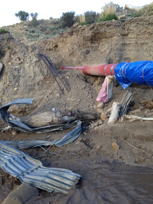 (Photo courtesy of Utah Division of Wildlife Resources) Gordon Creek Energy buried these electrical cables serving its gas field west of Price without permission across state land managed for deer and elk winter range. Because safeguards were not followed, the project resulted in erosion damage pictured here, according to Utah wildlife officials. Now the high-voltage power lines are draped across erosion gullies in the Gordon Creek Wildlife Management Area.