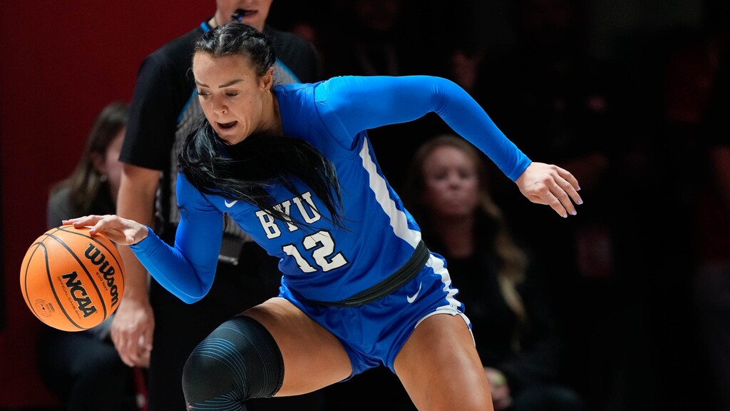 (Francisco Kjolseth  |  The Salt Lake Tribune) BYU Cougars forward Lauren Gustin (12) wins a battle against Utah Utes forward Alissa Pili (35) as Utah hosts BYU in NCAA basketball at the Huntsman Center in Salt Lake City on Saturday, Dec. 2, 2023.