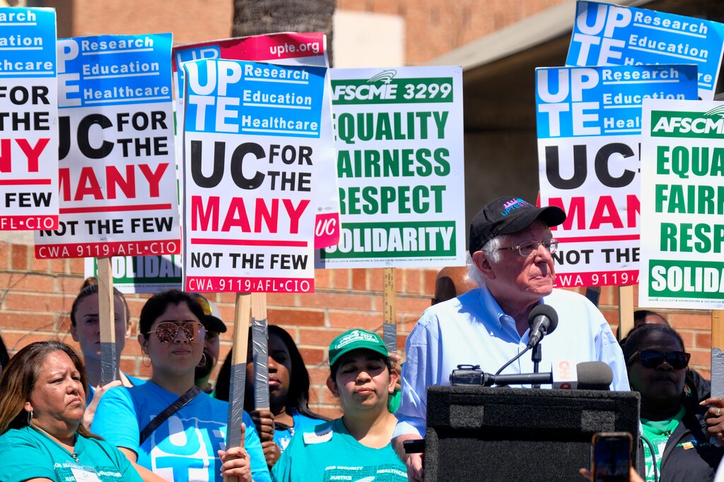 (Richard Vogel | Associated Press file photo) Vermont Sen. Bernie Sanders talks to workers at a rally at the University of California Los Angeles on March 20, 2019.