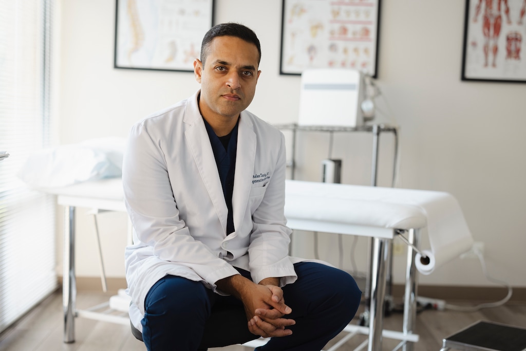 (Taylor Glascock | The New York Times) Dr. Azlan Tariq in Oakbrook Terrace, Ill., on July 1, 2024. Tariq uses artificial intelligence to help fight insurance denials of treatments that need pre-approval.
