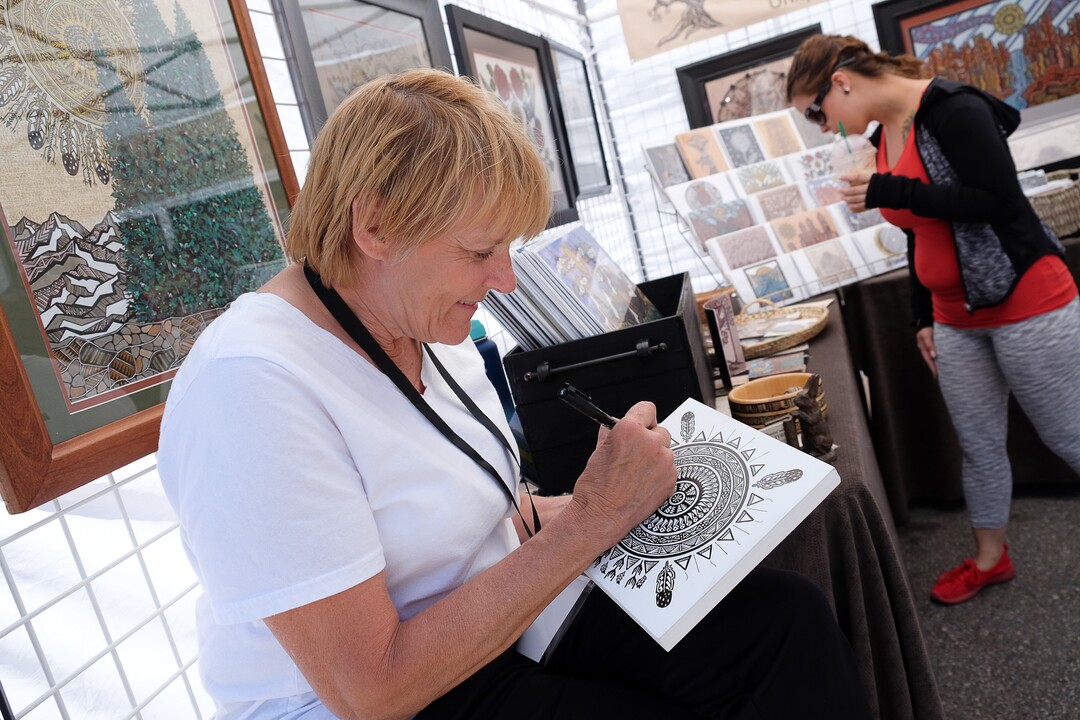 (Francisco Kjolseth  |  The Salt Lake Tribune)  Lynette Nichols works on her art inspired by "Mother Earth," as she joins the Ogden Arts Festival that brings local and regional artists, creatives and entertainers to Ogden, UT on June 8th and 9th.