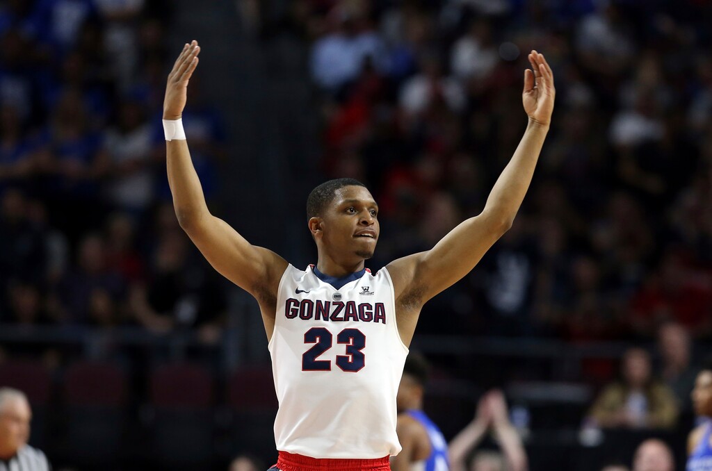 FILE - In this March 6, 2018 file photo Gonzaga's Zach Norvell Jr. raises his hands to the crowd during the first half of the West Coast Conference tournament championship NCAA college basketball game against BYU in Las Vegas. Norvell is providing Gonzaga with fiery spark on the way to the Sweet 16. Norvell hit tiebreaking 3-pointer in NCAA Tournament opening round and scored 28 points in second round. (AP Photo/Isaac Brekken, file)