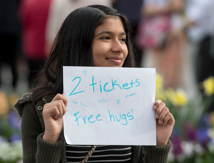 (Rick Egan  |  The Salt Lake Tribune)         Emily Juarez holds a sign as she hopes to get a ticket for the Saturday morning session of the188th Annual General Conference in Salt Lake City,  Saturday, March 31, 2018.