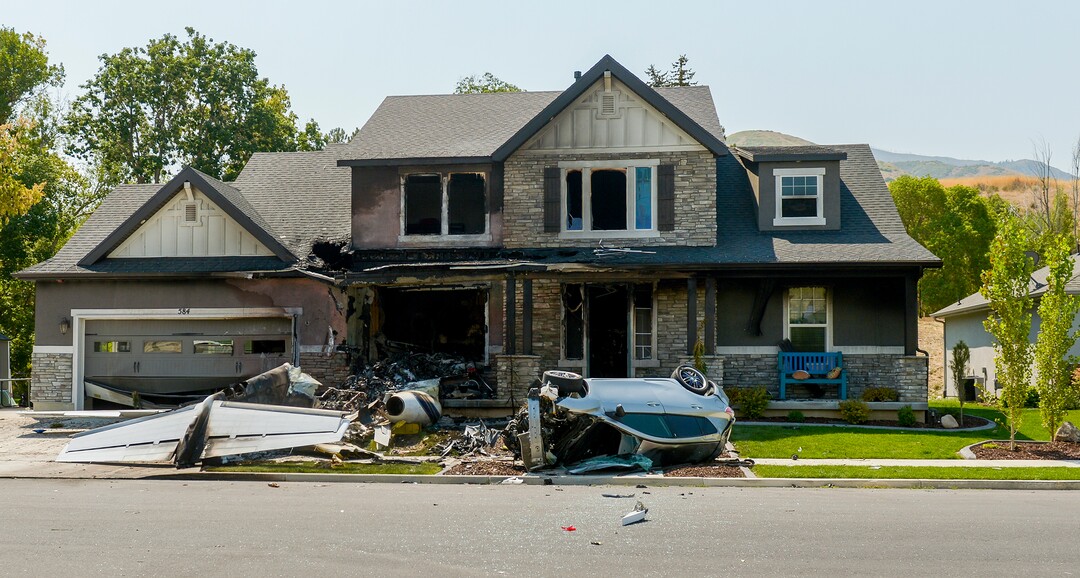 Leah Hogsten  |  The Salt Lake Tribune   The house at 584 E. East Canyon Road in Payson where Duane "Rhedd" Youd, 47, crashed a plane about 2:30 a.m., Monday, August 13, 2018. Firefighters arrived to find the home engulfed in flames. The two people inside the home escaped through the back of the home and were uninjured. Youd had been booked into the Utah County Jail about 7:30 p.m. Sunday after being suspected of assaulting his wife. He bailed out of jail; returned to the home with a police officer about midnight to retrieve belongings and his truck; and left without incident.
