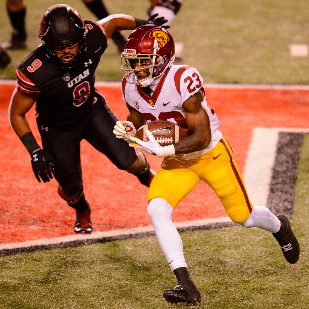(Trent Nelson  |  The Salt Lake Tribune) USC Trojans running back Kenan Christon (23) runs the ball, with Utah Utes linebacker Sione Fotu (9) defending, as the Utah Utes host the USC Trojans, NCAA football at Rice-Eccles Stadium in Salt Lake City on Saturday, Nov. 21, 2020.