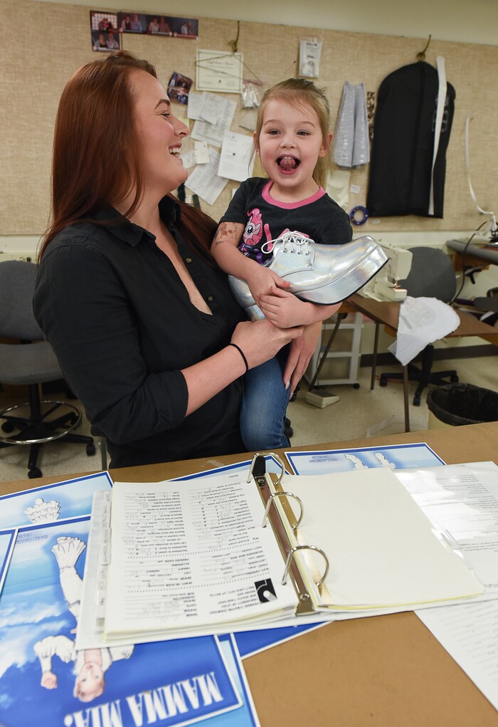 (Francisco Kjolseth  |  The Salt Lake Tribune)  Actor Megan Shenefelt finds approval from her daughter Sovay, 3, in part of her costume for the upcoming musical "Mamma Mia!" as cast and crew prepare for the run at Pioneer Theatre. 