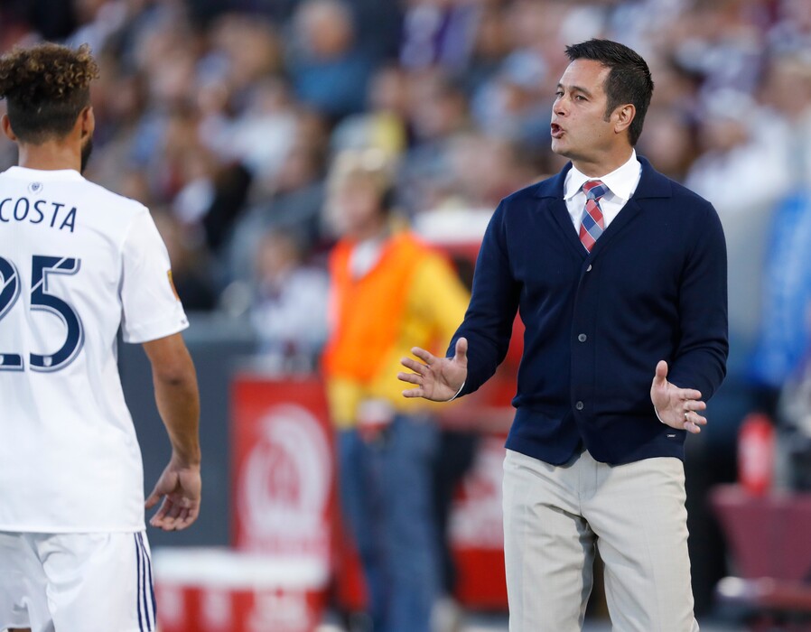 Real Salt Lake midfielder Danilo Acosta, left, is directed by coach Mike Petke while facing the Colorado Rapids during the first half of their April match in Commerce City, Colo. (AP Photo/David Zalubowski)