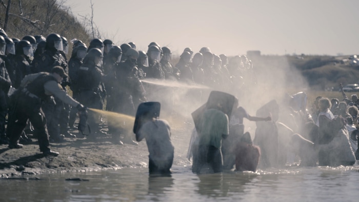 (Cody Lucich  |  courtesy Sundance Institute) Activists face a barrage from militarized police at the site of the proposed Dakota Access Pipeline, in a scene from Cody Lucich's "Akicita: The Battle of Standing Rock," which will screen in the Documentary Premieres program of the 2018 Sundance Film Festival.