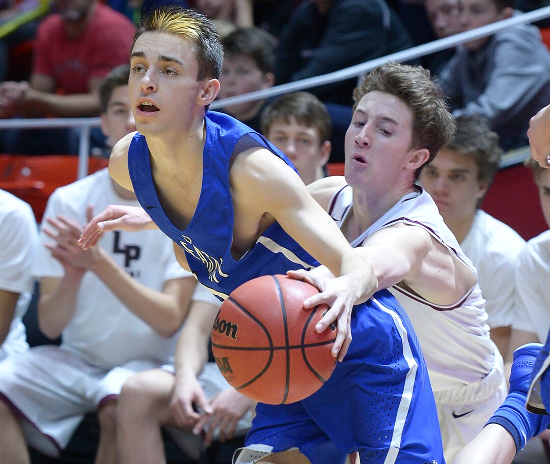 (Leah Hogsten  |  The Salt Lake Tribune) Lone Peak's Jackson Brinkerhoff (30) tries to steal from Pleasant Grove's Tyler Fairbanks (12). Pleasant Grove plays Lone Peak to win the 6A High School Boys’ Basketball Tournament Championship at the Jon M. Huntsman Center in Salt Lake City, Saturday, March 3, 2018. 