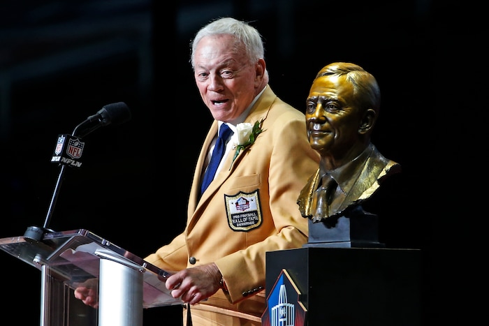 Dallas Cowboys owner Jerry Jones speaks next to a bust of him during inductions at the Pro Football Hall of Fame on Saturday, Aug. 5, 2017, in Canton, Ohio. (AP Photo/Ron Schwane)