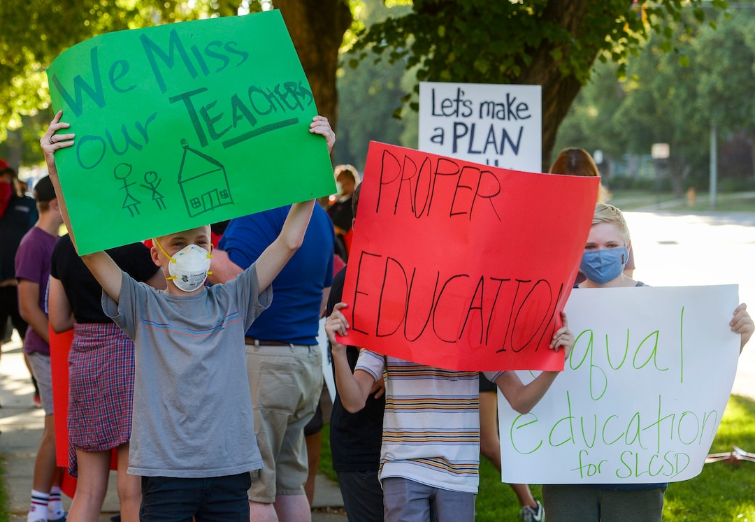 (Leah Hogsten  |  The Salt Lake Tribune) Parents and students within the Salt Lake City School District rally for K-12 students to return in-person to school this fall, July 15, 2020.