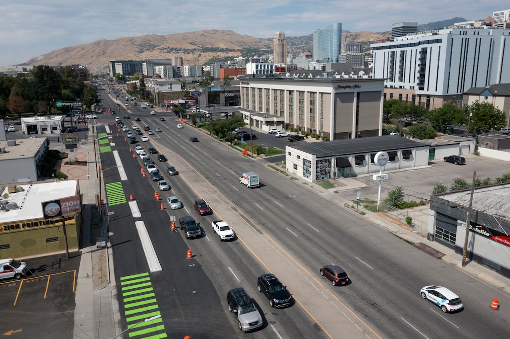 (Bethany Baker | The Salt Lake Tribune) Construction of a protected bike path extension along 300 West in Salt Lake City in 2025. A new bill increases state oversight of projects like this one.