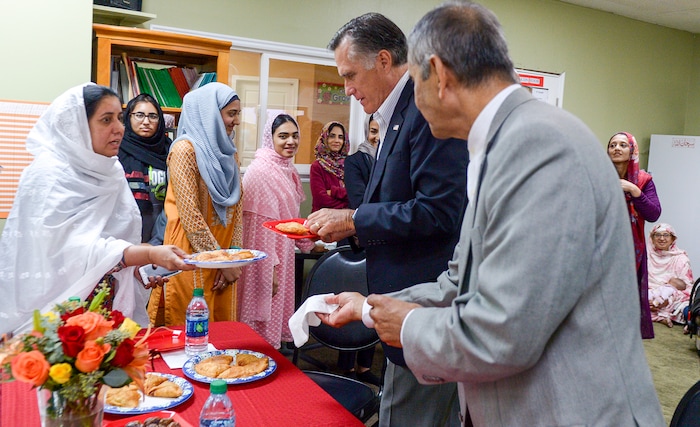 Leah Hogsten  |  The Salt Lake Tribune  U.S. Senate candidate Mitt Romney is offered samosas by Utah Islamic Center members, Oct. 26, 2018 before Friday special prayers.