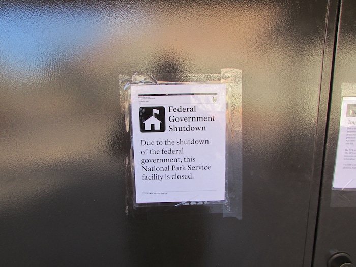 (Tom Wharton | The Salt Lake Tribune) Signs such as this one were posted on most of the Zion National Park restrooms. Park services have been reduced because of a federal government shutdown that went into effect at midnight Friday after the Senate was unable to pass a new spending bill.