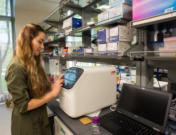 (Rick Egan  |  The Salt Lake Tribune)     Zoe Praggastif, graduate student, demonstrates the qPCR machine at the opening of the new Gary and Ann Crocker Science Center on Presidents Circle, Thursday, April 19, 2018.


