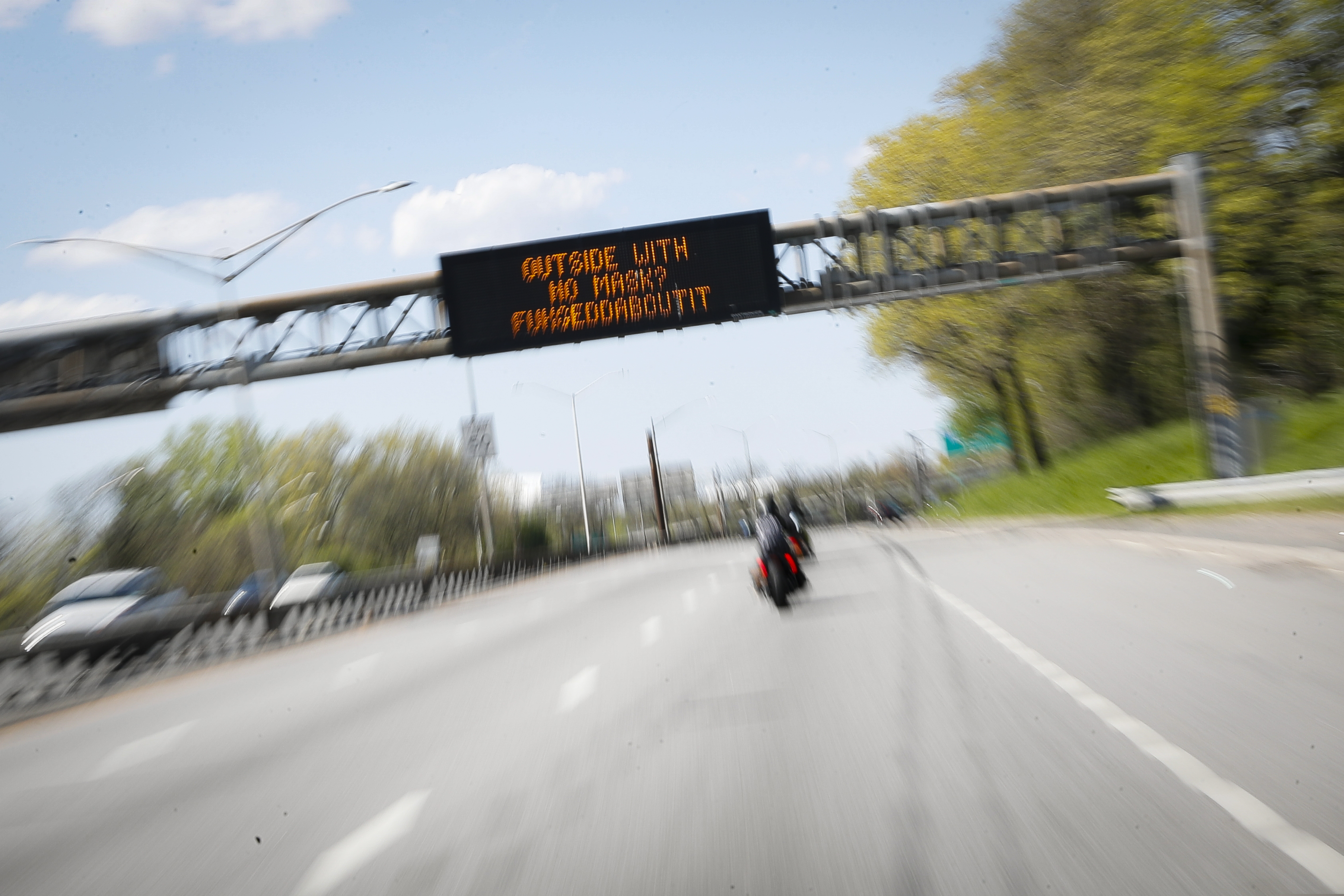Melanie Milano and Ashley Zeolla ride their motorcycles towards Queens from the Brooklyn borough of New York after a series of delivery runs of personal protective equipment, Sunday, May 3, 2020. Milano has made about 15 runs with Masks for Docs, many alongside girlfriend Zeolla. (AP Photo/John Minchillo)