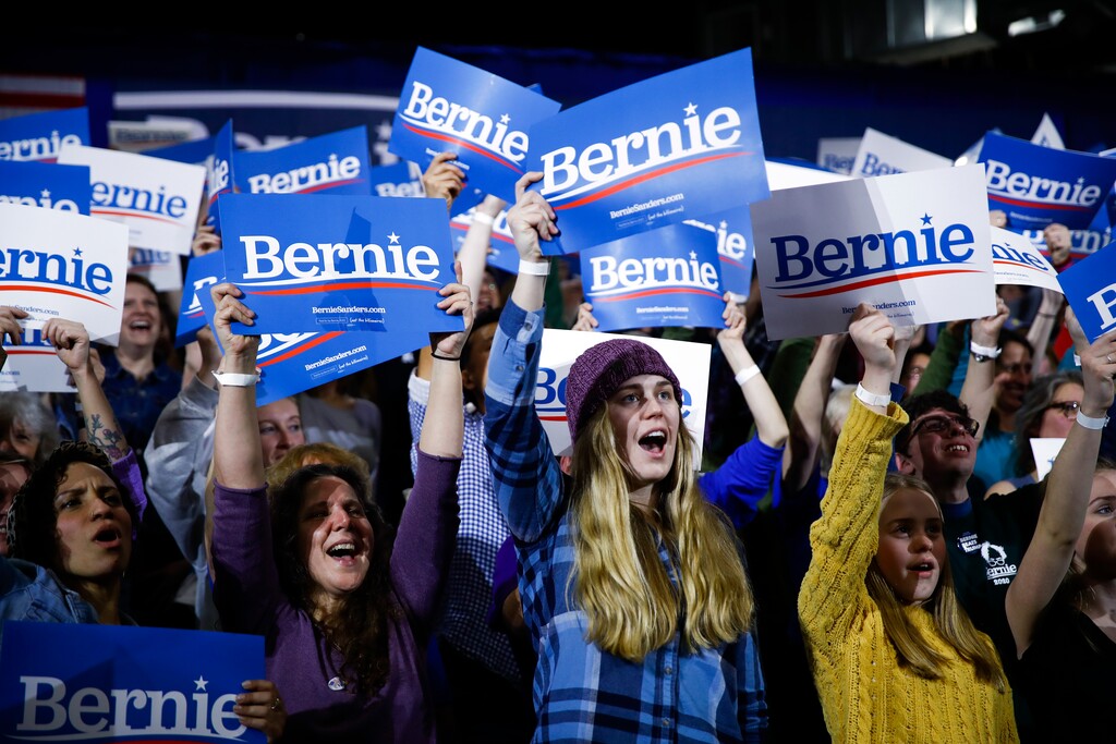 Supporters of Democratic presidential candidate Sen. Bernie Sanders, I-Vt., cheer during a primary night election rally in Essex Junction, Vt., Tuesday, March 3, 2020. (AP Photo/Matt Rourke)