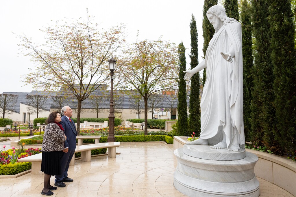 (The Church of Jesus Christ of Latter-day Saints)
Apostle Ronald Rasband and his wife, Melanie, ponder a replica of the Christus statue on the grounds of the Paris Temple on Friday, April 14, 2023. Tribune columnist Gordon Monson is urging church leaders to focus on Jesus' teachings, not pumping up patriotism.