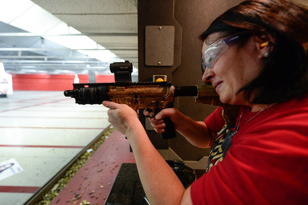 (Francisco Kjolseth  |  The Salt Lake Tribune)  Melanie Lewis of Kearns fires a custom Arma Lite 9mm at The Gun Vault in South Jordan. Lewis is a member of The Well-Armed Woman club where women with concealed carry permits meet once a month. Of the concealed carry permits issued by the state, only about one in five is held by a woman.