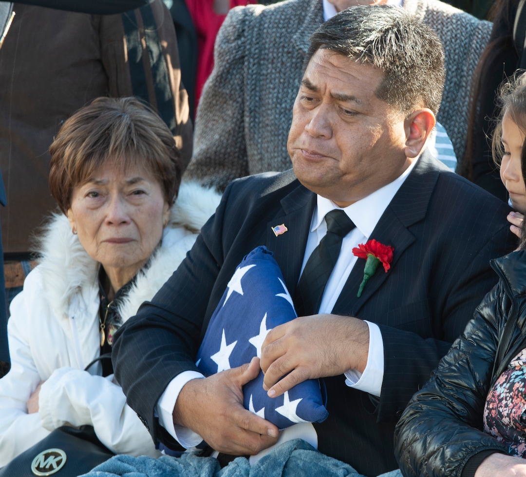 (Rick Egan  |  The Salt Lake Tribune)   Kirk T. Fuchigami Sr. holds the flag during the the graveside service for his son, Kirk T. Fuchigami Jr. who was killed in Afghanistan.  Monday, Dec. 9, 2019.