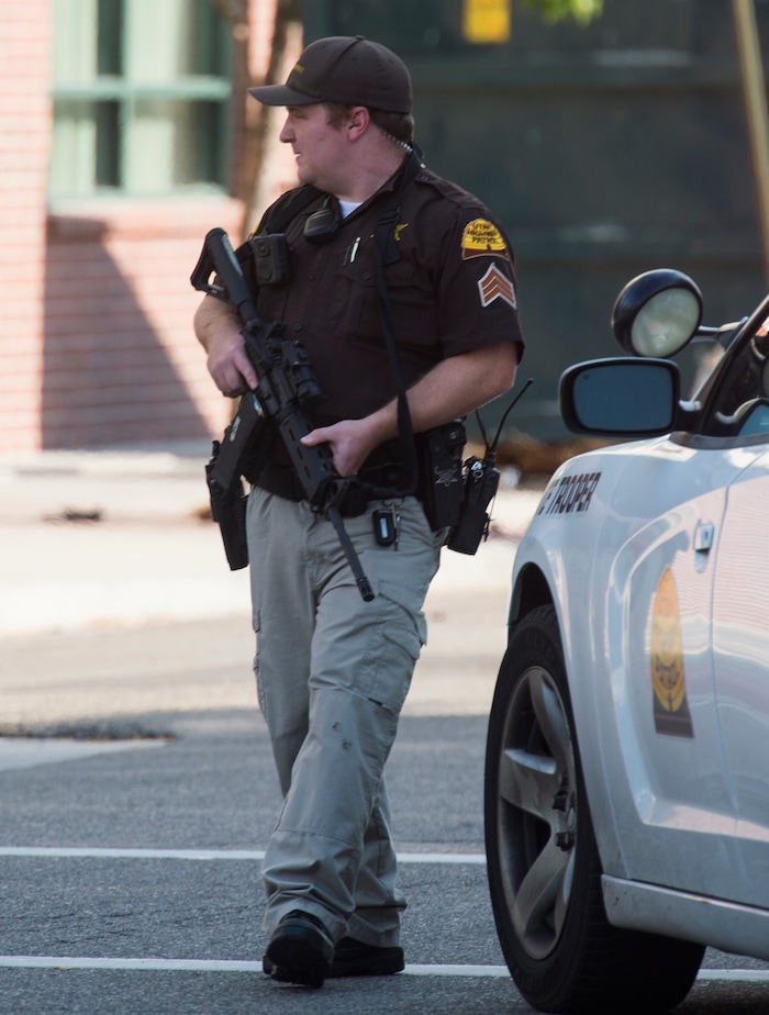 (Rick Egan  |  The Salt Lake Tribune)   Police stand by as swat teams search buildings on Rio Grande Street for a suspect that fired shots at a police officer,  Wednesday, Sept. 5, 2018.


