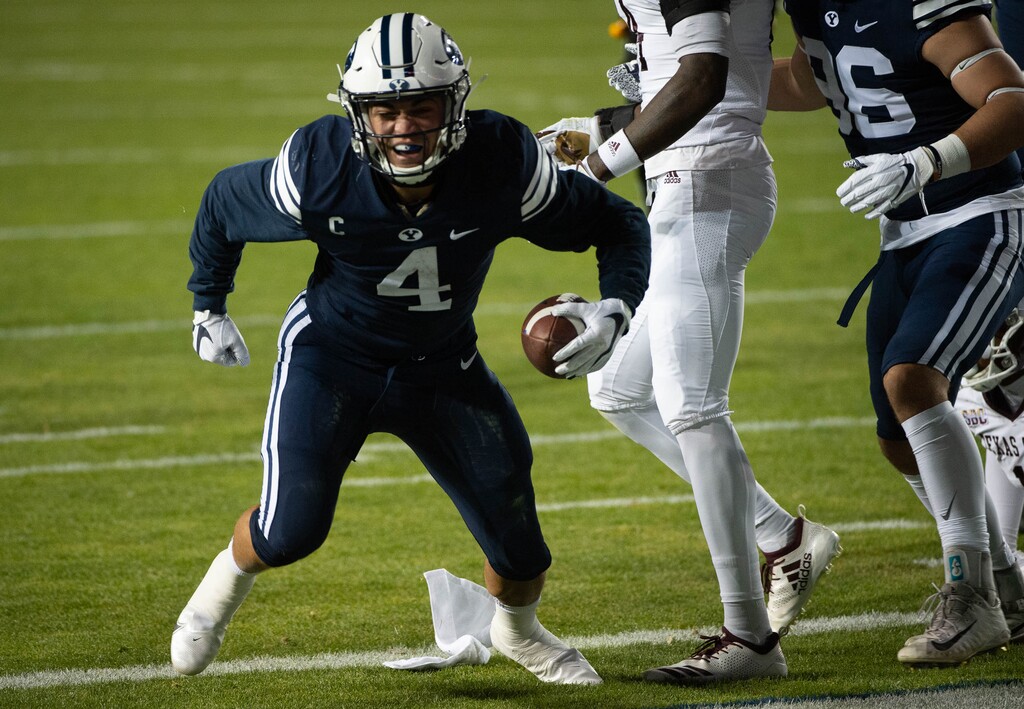 (Francisco Kjolseth | The Salt Lake Tribune) Brigham Young Cougars running back Lopini Katoa (4) celebrates the Cougar’s first touchdown against Texas State during an NCAA college football game at LavVell Edwards Stadium, Saturday, oct. 24, 2020, in Provo, Utah.