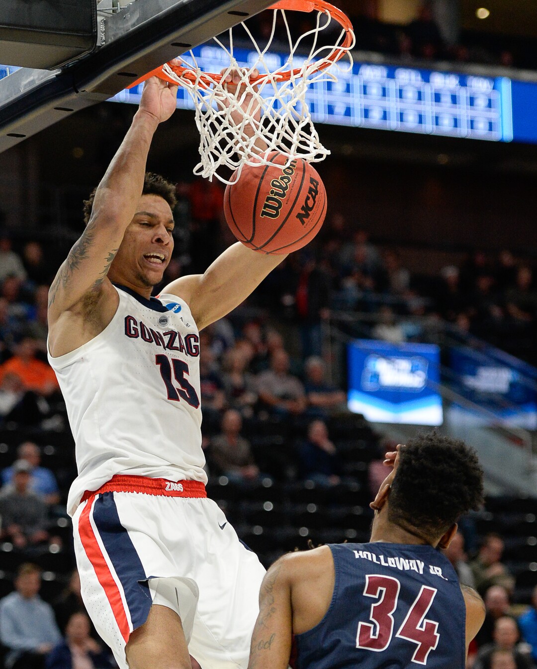 (Francisco Kjolseth  |  The Salt Lake Tribune)  Gonzaga Bulldogs forward Brandon Clarke (15) dunks over Fairleigh Dickinson Knights forward Mike Holloway Jr. (34) as Gonzaga faces Fairleigh Dickinson in their first round menÕs NCAA March Madness tournament game at Vivint Smart Home Arena in Salt Lake City on Thursday, March 21, 2019.