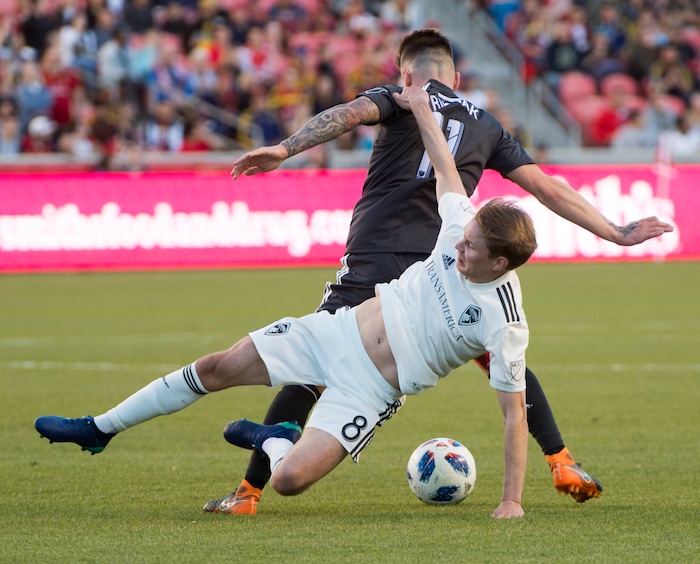 (Rick Egan  |  The Salt Lake Tribune)    Real Salt Lake midfielder Albert Rusnak (11) gets tangled up with Colorado Rapids midfielder Johan Blomberg (8), in MLS soccer action, RSL vs Colorado Rapids at Rio Tinto Stadium, Saturday, April 21, 2018.


