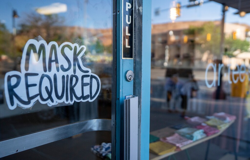 (Rick Egan | The Salt Lake Tribune) Signs notifying customers that masks are required can be found on the doors of most restaurants and many gift shops on Main Street in Moab, photographed May 14, 2021.