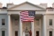(Carolyn Kaster | The Associated Press) In this Sept. 2017 file photo, a flag is waved during an immigration rally outside the White House, in Washington.