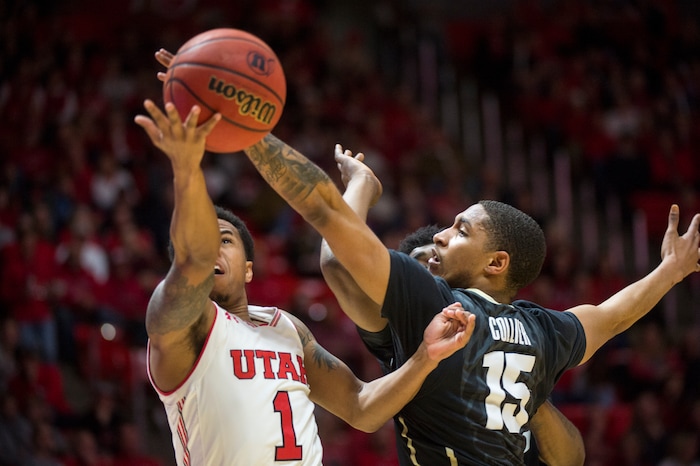 (Rick Egan  |  The Salt Lake Tribune)  Utah Utes guard Justin Bibbins (1) takes the ball to the hoop, as Colorado Buffaloes guard Dominique Collier (15) defends, in PAC-12 basketball action between Utah Utes and Colorado Buffaloes, at the Jon M. Huntsman Center, Saturday, March 3, 2018.