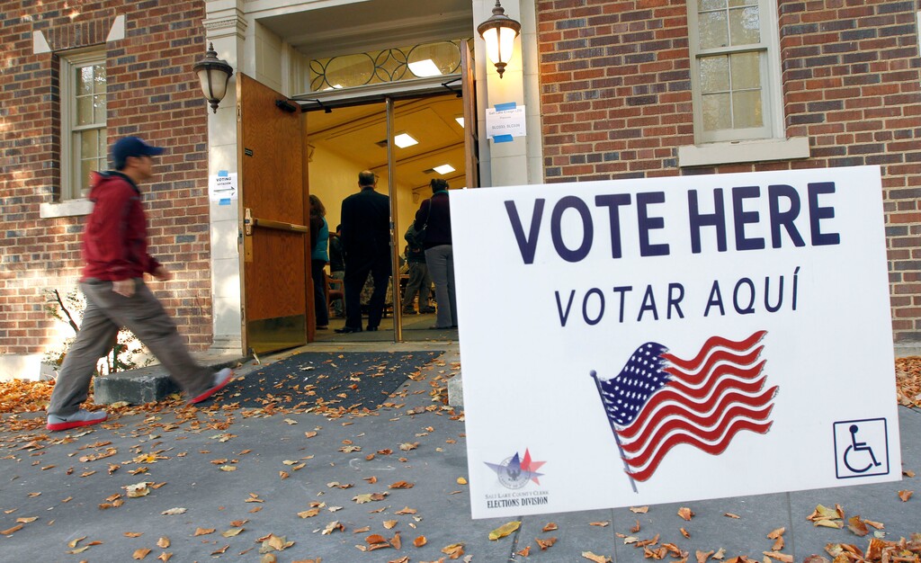 (Al Hartmann  |  Tribune file photo)
People walk into the recreation hall at the Salt Lake Ensign LDS Church at 109 G Street to vote in precincts SLC033 and SLC039 Tuesday morning Novmeber 6.