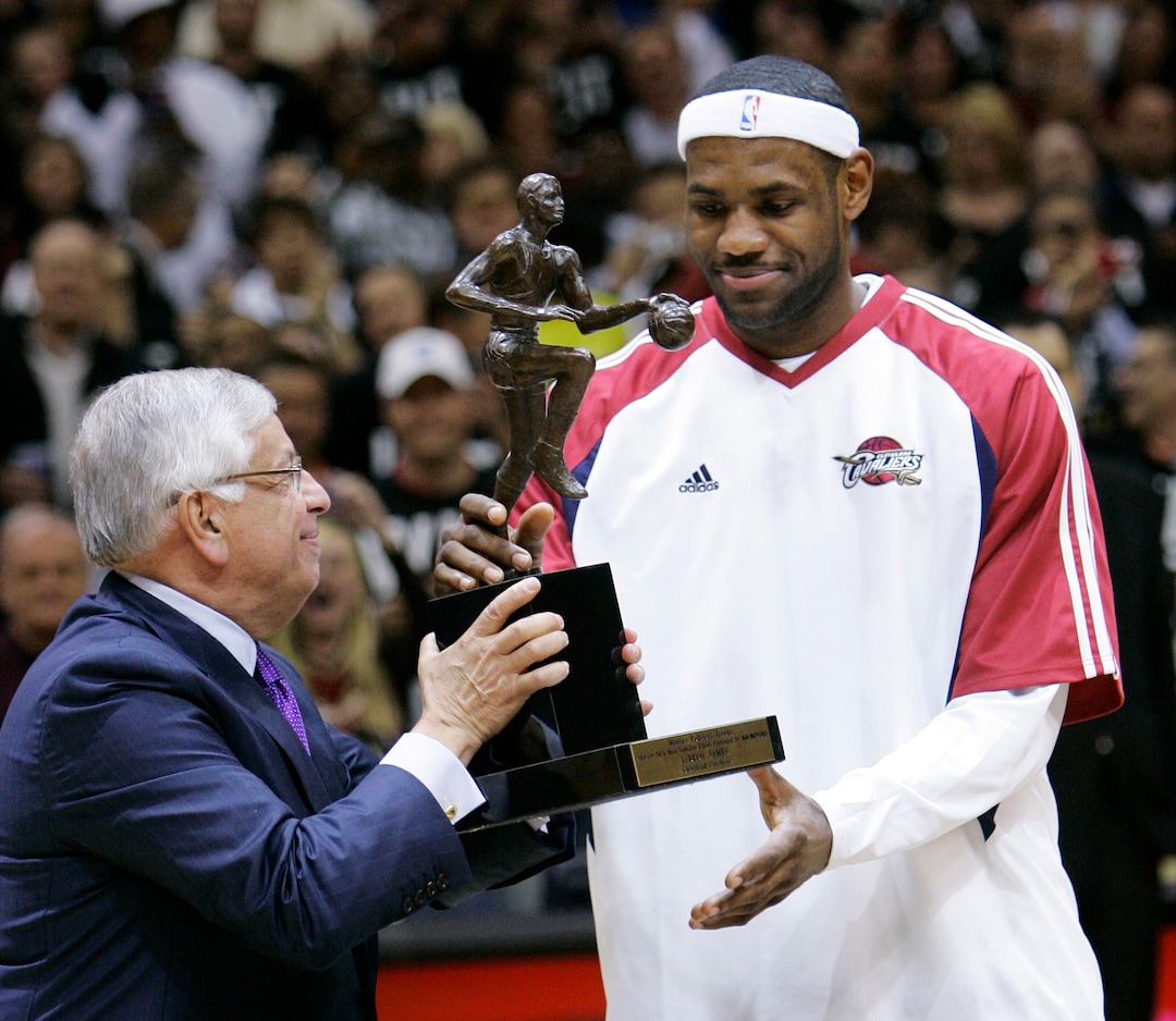 (Mark Duncan | AP File) In this Tuesday, May 5, 2009 photo, NBA commissioner David Stern, left, presents Cleveland Cavaliers' LeBron James with the 2008-2009 NBA Most Valuable Player trophy before the Cavaliers' Eastern Conference basketball semifinals game against the Atlanta Hawks in Cleveland. David Stern, who spent 30 years as the NBA's longest-serving commissioner and oversaw its growth into a global power, has died on New Year’s Day, Wednesday, Jan. 1, 2020. He was 77.