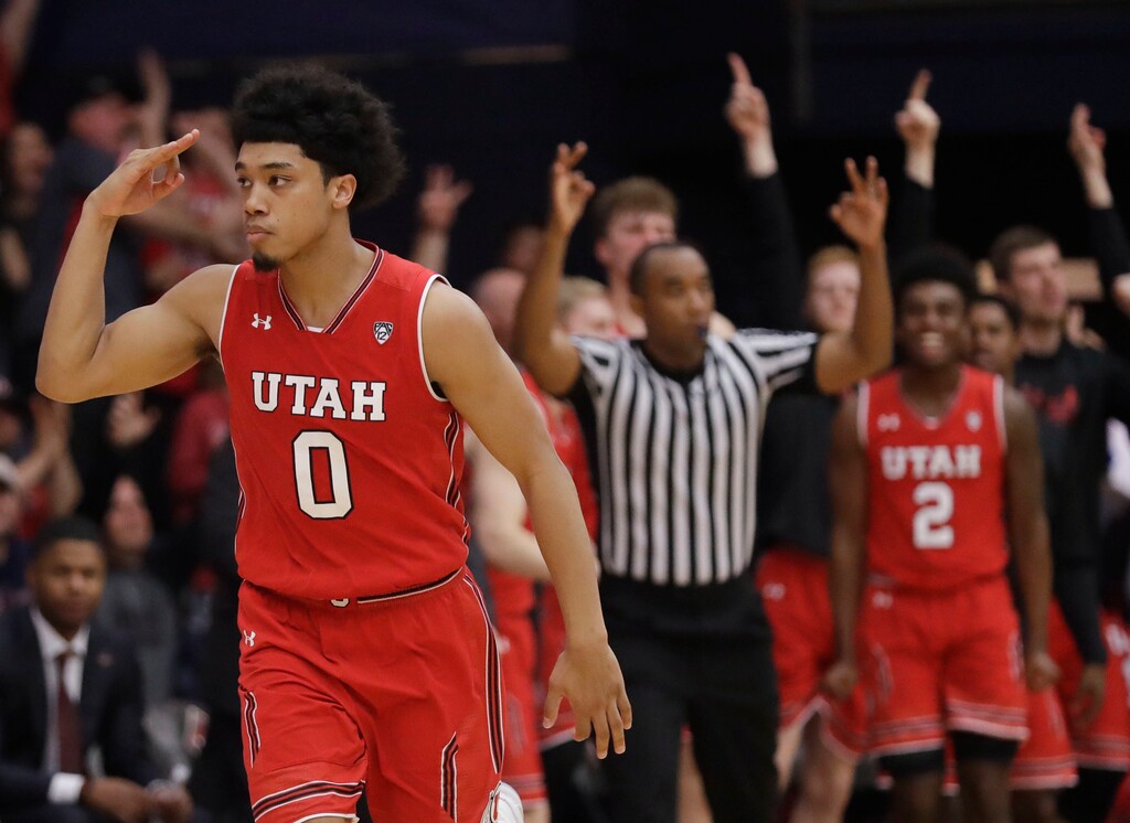 Utah's Sedrick Barefield (0) signals after making a 3-point basket against Saint Mary's during overtime in an NCAA college basketball game in the quarterfinals of the NIT, Wednesday, March 21, 2018, in Moraga, Calif. (AP Photo/Marcio Jose Sanchez)