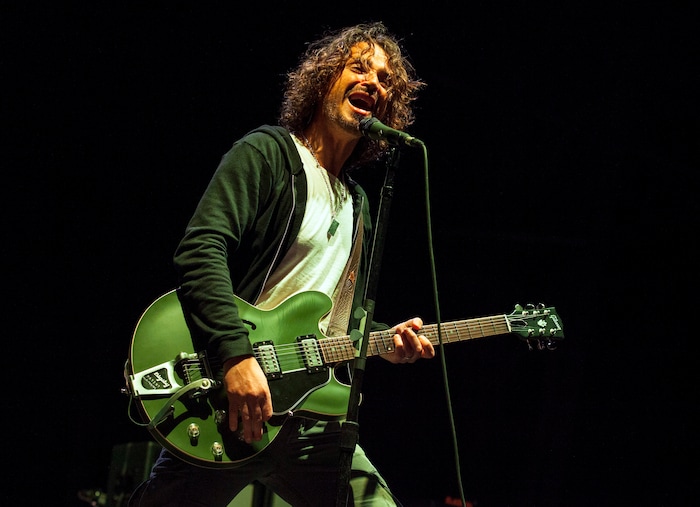 FILE - In this May 19, 2013 file photo, Chris Cornell of Soundgarden performs at Rock on the Range in Columbus, Ohio. Cornell, 52, who gained fame as the lead singer of the bands Soundgarden and Audioslave, died at a hotel in Detroit and police said Thursday, May 18, 2017, that his death is being investigated as a possible suicide. (Photo by Barry Brecheisen/Invision/AP, File)
