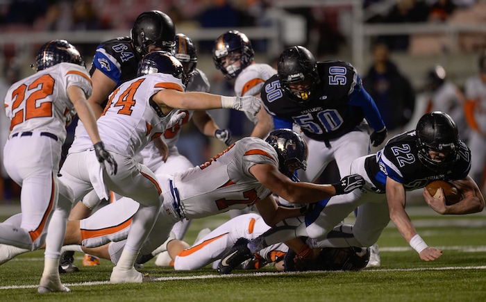 (Francisco Kjolseth  |  The Salt Lake Tribune)  Silas Young of Stansbury is taken down by Mountain Crest in their class 4A semifinal game at Rice-Eccles Stadium, Thursday, Nov. 9, 2017.