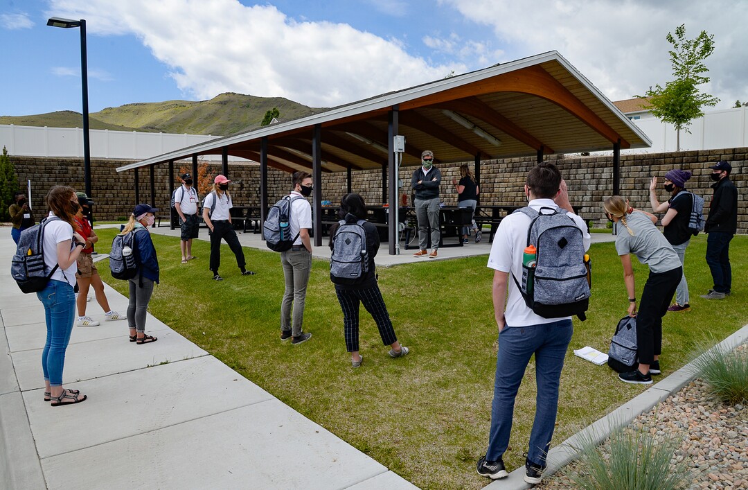 (Francisco Kjolseth  |  The Salt Lake Tribune) Steven Alder, center right, director of field operations for the HERO project and a U. professor of family and preventive medicine talks with a team of students in Herriman on Thursday, May 4, 2020, before they fan out into the community to find people willing to be tested for COVID-19, to find out how widespread the disease actually is in the state. Educators and business leaders are hoping the Utah Health & Economic Recovery Outreach program, where college-age volunteers are now randomly finding residents to be tested for COVID-19, will blossom into something bigger. They are proposing to expand it into what will be called Hope Corps, with hundreds of students and other volunteers offering hands-on advice and resources to restaurants and retailers who's businesses are struggling in the pandemic.