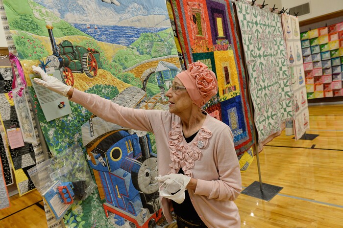 (Francisco Kjolseth  |  The Salt Lake Tribune)  Nacele Hart overlooks her more than 100 quilts and numerous sewing projects created over a 10-year period for her children, grandchildren and great-grandchildren. On Friday at a church in Orem her family put them on display with plans to hand them out Saturday to her loved ones. She's also currently battling cancer.