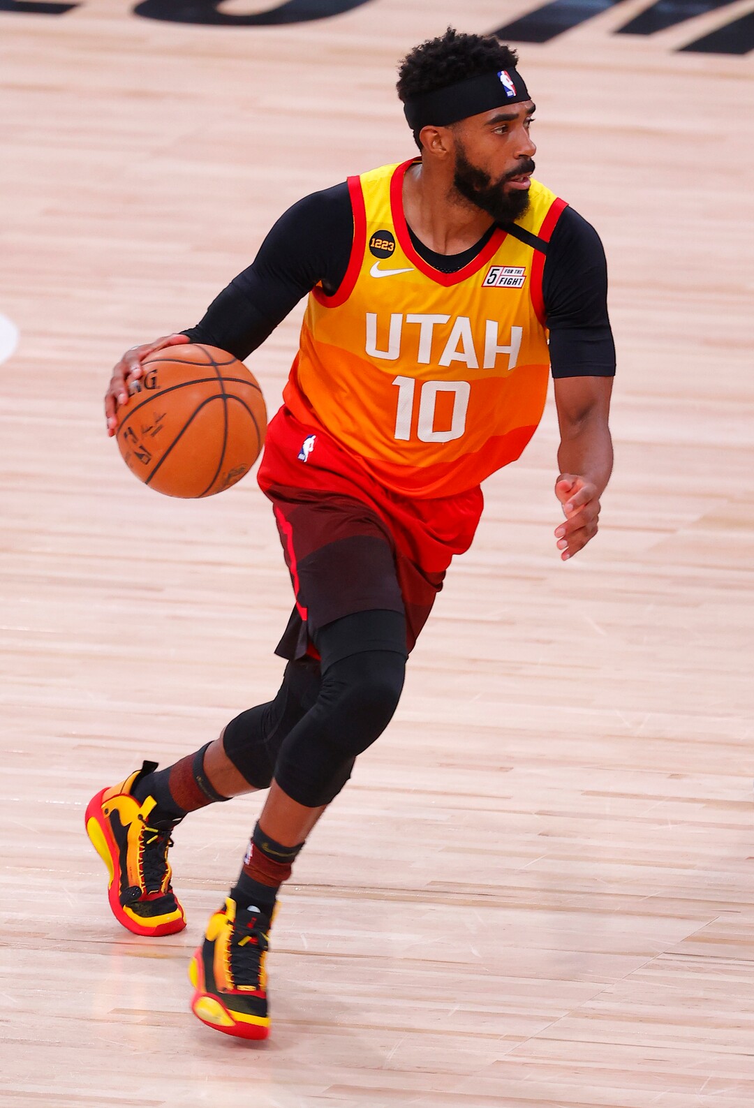 Utah Jazz's Mike Conley moves the ball upcourt against the Denver Nuggets during the third quarter of Game 3 of an NBA basketball first-round playoff series, Friday, Aug. 21, 2020, in Lake Buena Vista, Fla. (Mike Ehrmann/Pool Photo via AP)